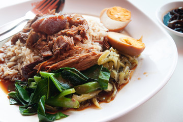 Stewed pork with rice and egg, Chinese-Thai traditional favorite food. Unhealthy food