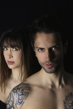 book cover design. beautiful woman and an handsome man on black background