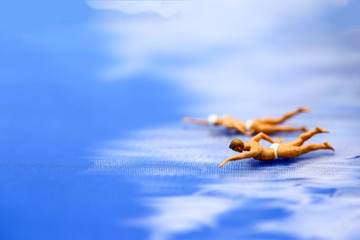 Miniature people: Vacationers are enjoy to swimming.