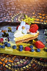 cream and chocolate cake with fruit