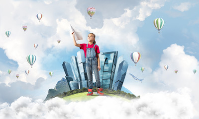 Concept of careless happy childhood with girl dreaming about future