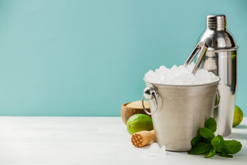 Metal ice bucket and mojito ingredients