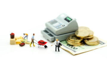 Miniature people : Businessman and construction worker with money,coins,contract of Business Construction concept.