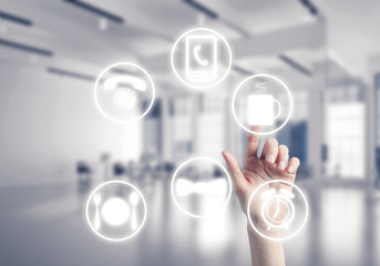 Modern office interior and close of businesswoman hand choosing 