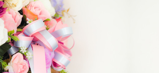 Blurred image, pink flower bouquet and white wall background