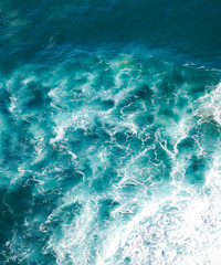 beautiful natural abstract background, turquoise water and waves are broken against a stone. Cabo...