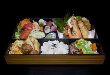Bento box containing a variety of Japanese foods