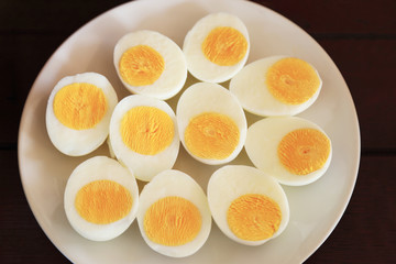 Hard boiled eggs in white dish.
