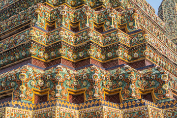 Fototapeta premium Pagoda is in Wat Pho that was named as the temple of the pagoda or chedi that are decorated with yellow glaze or glazed tiles or dark blue. 