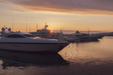 Luxury yachts docked in sea port at sunset, Sochi, Russia