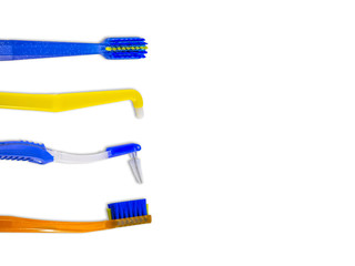 Special toothbrushes for care of braces (bracket systems), in row, isolated on white background, top view, with space for text