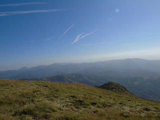 An amazing views to the city of Genova and the sea from the hills over the city with some clouds and foggy