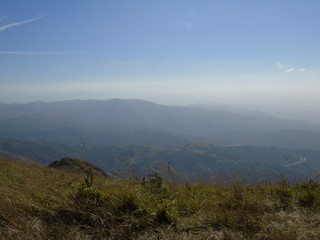 An amazing views to the city of Genova and the sea from the hills over the city with some clouds and foggy
