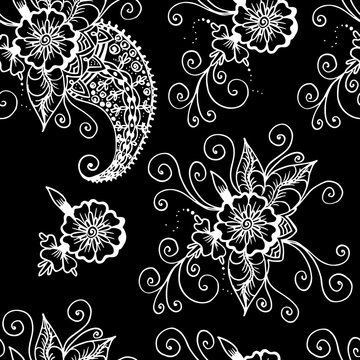 Flowers and paisley. Abstract linear drawing. Seamless pattern. White on a black background