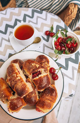 Homemade baked mini pies with fresh garden cherries