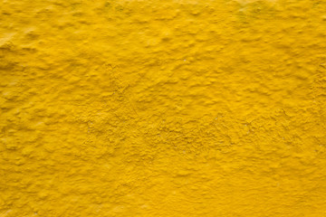 Yellow wall texture with cracks. Abstract background.