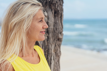 Thoughtful blond woman with windswept hair