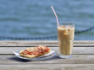 Coffee and a piece of pizza