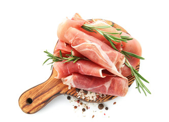 Wooden board with prosciutto on white background