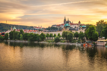 Naklejka na ściany i meble Beautiful golden view of Prague Castle and Vltava river after the sunset, Prague, Czech Republic, Europe