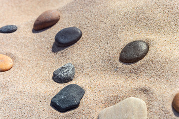 beautiful stones different colours on the sand