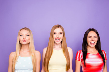 Portrait of crazy cool coquettes with different grimace facial expressions laughing sending kiss...