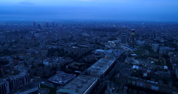 Milan, Italy: Aerial view of Milan at dawn. Flying over the city.