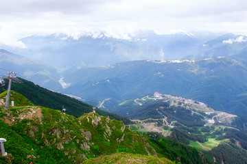 Naklejka premium Landscape haze fog mountains snow tops. Sochi. Russia. Krasnaya Polyana.