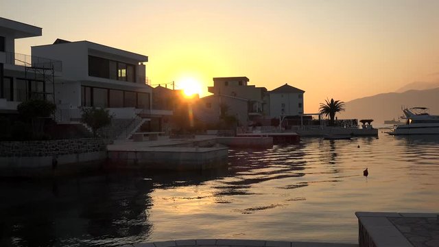View of the Kotor Bay from the Obala Djurasevica coast at sunrise. Montenegro