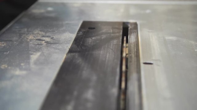 Male hand working working with a screwdriver in carpentry workshop