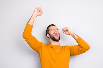 People leadership wonderment concept. Portrait of cheerful excited joyful careless handsome attractive delightful yelling shouting guy isolated on gray background