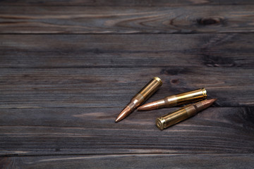 Cartridges on a dark wooden  background