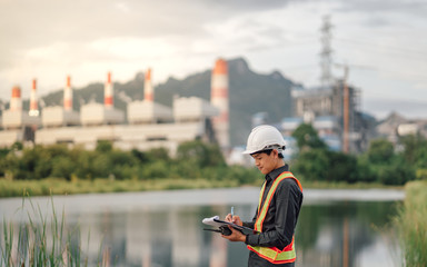 Asian male power plant engineer is working