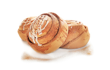 Delicious cinnamon buns on white background