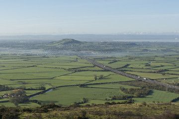 Brent Knoll and the M5 Motorway from the Mendip Hills