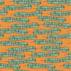 Seamless vector pattern with banana leaves on orange for wrapping, craft, fabric, ceramic, craft