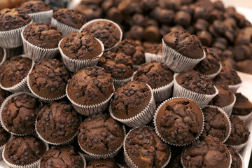 Fresh tasty muffins on display in bakery