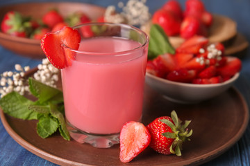 Glass of tasty strawberry starch drink on table