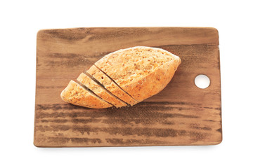 Board with fresh tasty bread on white background