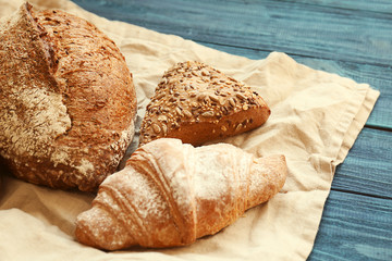 Different bakery products on wooden table