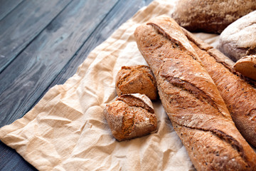 Fresh tasty bakery products on wooden table