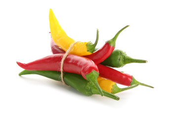 Different chili peppers on white background