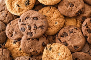 Delicious cookies with chocolate as background