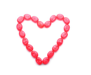 Heart made of sweet candies on white background