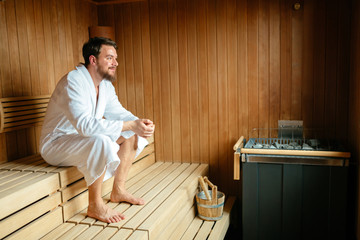 Healthy male in sauna relaxing