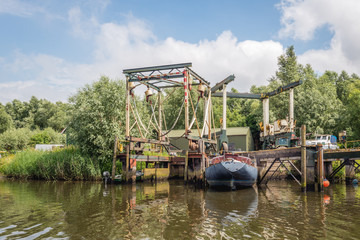 Obraz premium Old boat lifts in the water