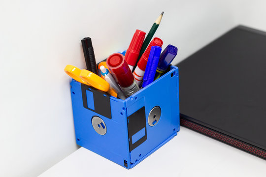 recycle floppy disk, Creative objects used for Store supplies such as pen pencils Scissors in a box on the table in work office, concept recycle floppy disk 