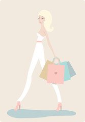 Young beautiful woman with shopping bags on light background