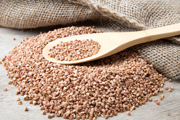 buckwheat groats and wooden spoon