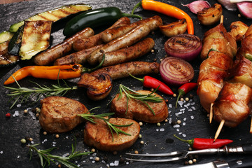 Assorted delicious grilled meat with vegetable on a barbecue